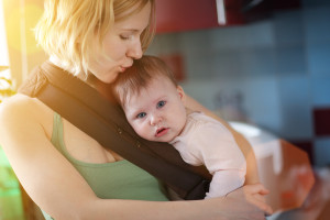 bigstock-Mother-carrying-baby-in-sling--15798881